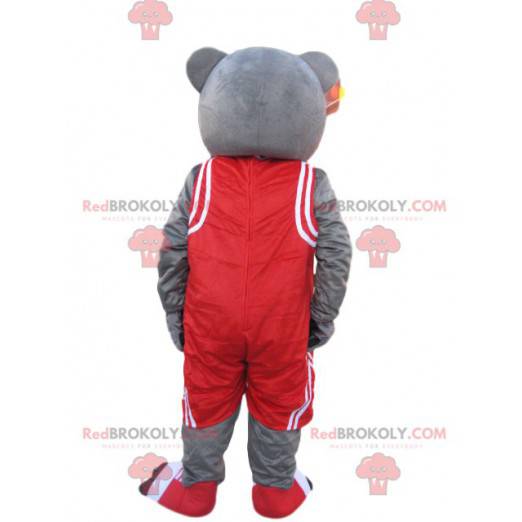 Mascotte d'ours gris avec une tenue de sport rouge -