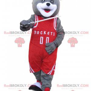 Mascotte d'ours gris avec une tenue de sport rouge -