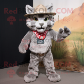 Gray Bobcat mascot costume character dressed with a Flare Jeans and Hat pins