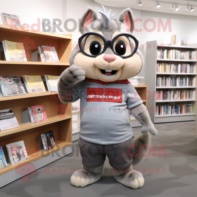 Gray Chipmunk mascot costume character dressed with a Graphic Tee and Reading glasses Gray Chipmunk mascot costume character dressed with a Graphic Tee and Reading glasses