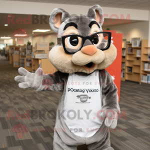 Gray Chipmunk mascot costume character dressed with a Graphic Tee and Reading glasses