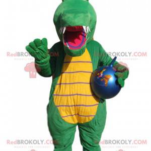 Mascota de cocodrilo verde con un globo azul. - Redbrokoly.com