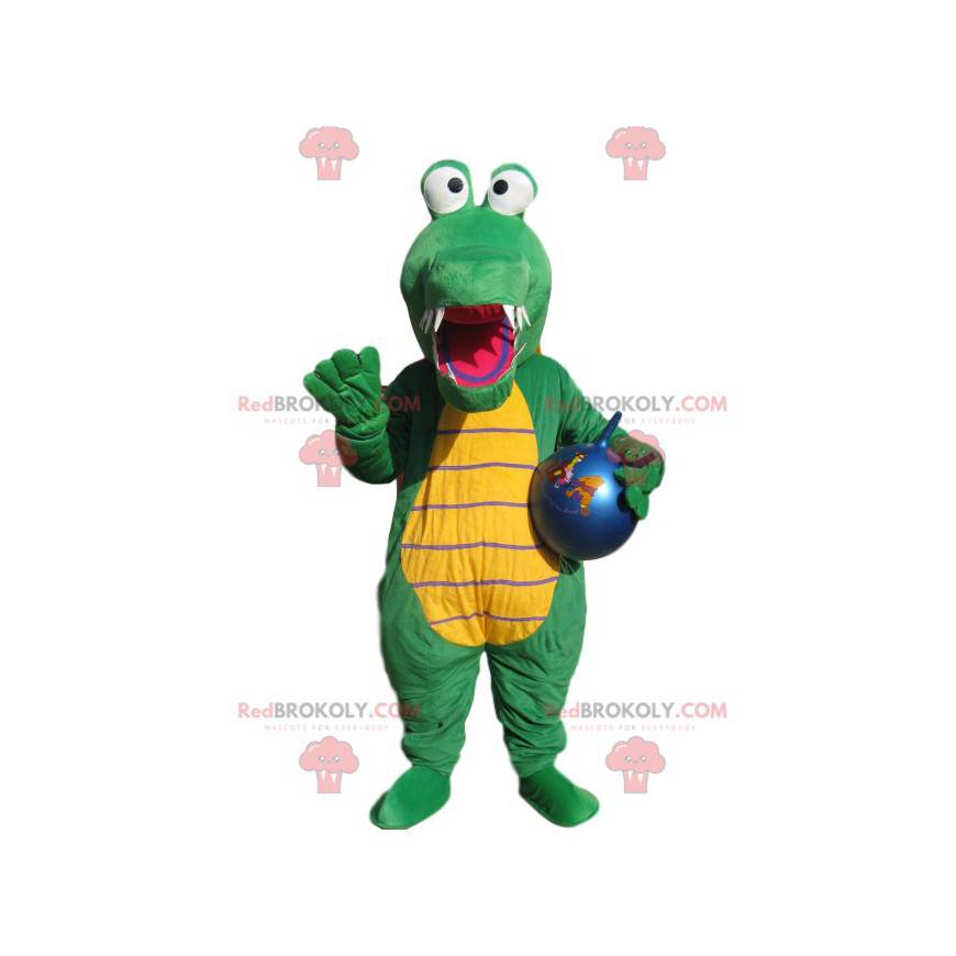 Mascotte coccodrillo verde con un palloncino blu. -