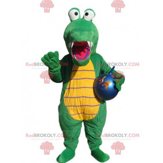 Mascota de cocodrilo verde con un globo azul. - Redbrokoly.com
