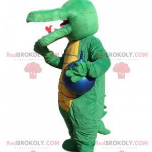 Mascotte groene krokodil met een blauwe ballon. - Redbrokoly.com