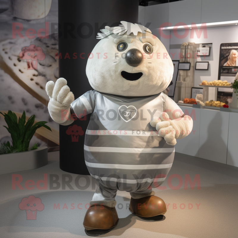 Silver Potato mascot costume character dressed with a Rugby Shirt and Rings