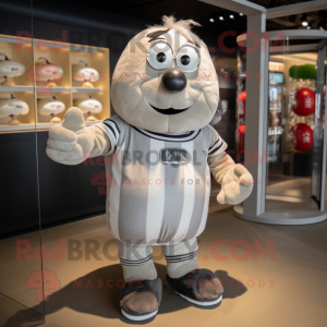 Silver Potato mascot costume character dressed with a Rugby Shirt and Rings