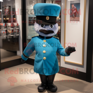 Teal British Royal Guard mascot costume character dressed with a Bomber Jacket and Hat pins