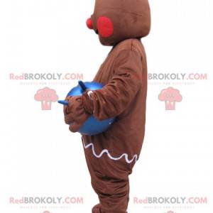 Gingerbread man mascot with a blue balloon - Redbrokoly.com