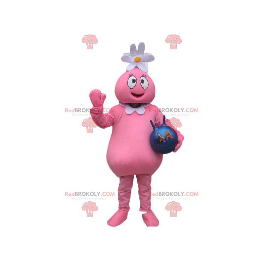 Mascota de personaje rosa con una flor en la cabeza y un globo.