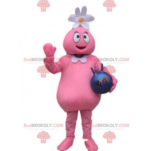 Mascota de personaje rosa con una flor en la cabeza y un globo.