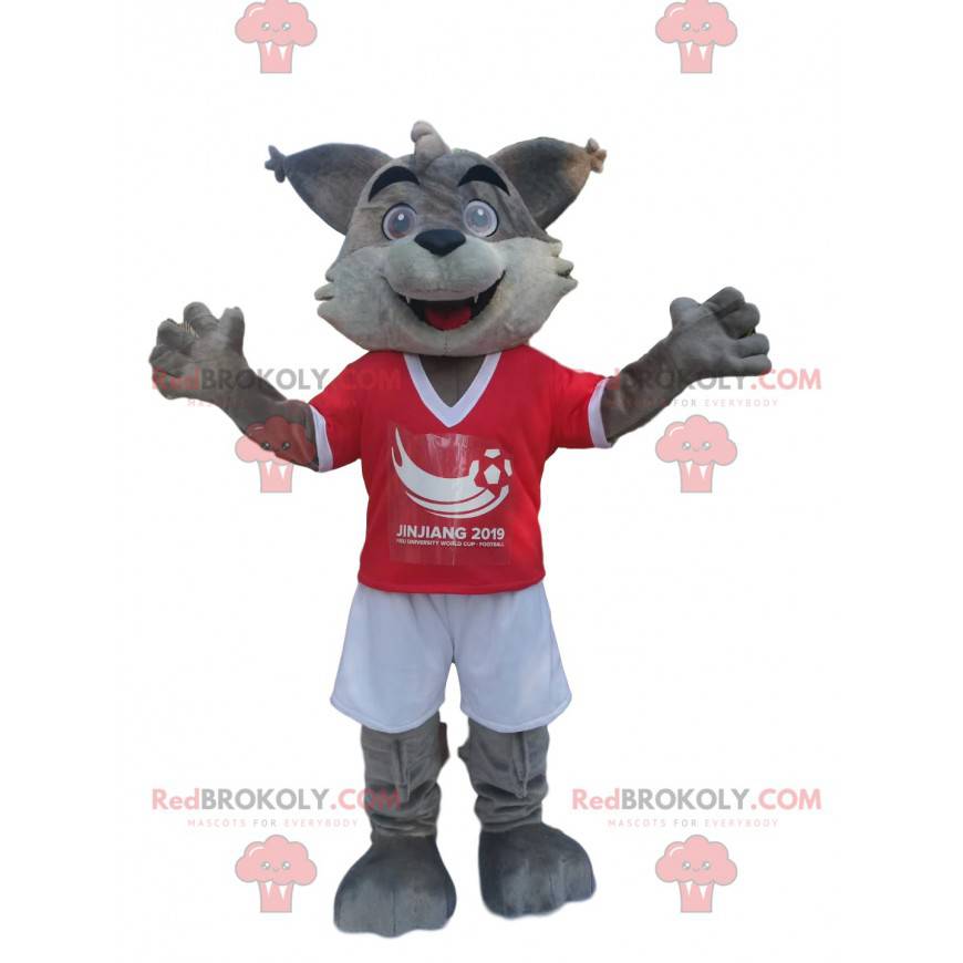 Mascote de lobo cinzento em roupas esportivas vermelhas e