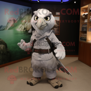 Silver Falcon mascot costume character dressed with a Dungarees and Backpacks