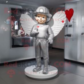 Silver Cupid mascot costume character dressed with a Long Sleeve Tee and Berets