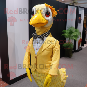 Yellow Guinea Fowl mascot costume character dressed with a Dress Shirt and Headbands