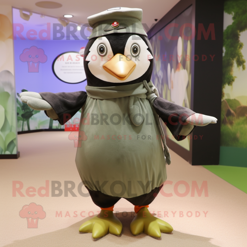 Olive Penguin mascot costume character dressed with a Dress and Berets Olive Penguin mascot costume character dressed with a Dress and Berets