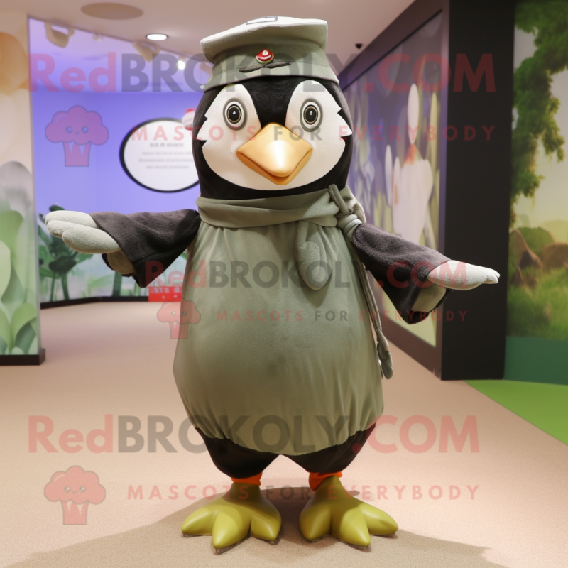 Olive Penguin mascot costume character dressed with a Dress and Berets