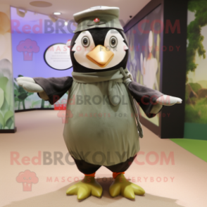 Olive Penguin mascot costume character dressed with a Dress and Berets