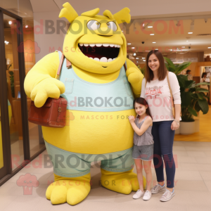 Lemon Yellow Ogre mascot costume character dressed with a Mom Jeans and Wallets