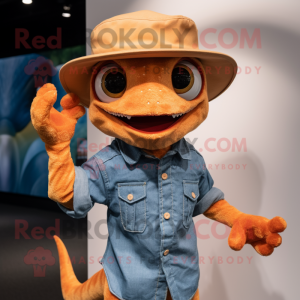 Orange Geckos mascot costume character dressed with a Denim Shirt and Hat pins