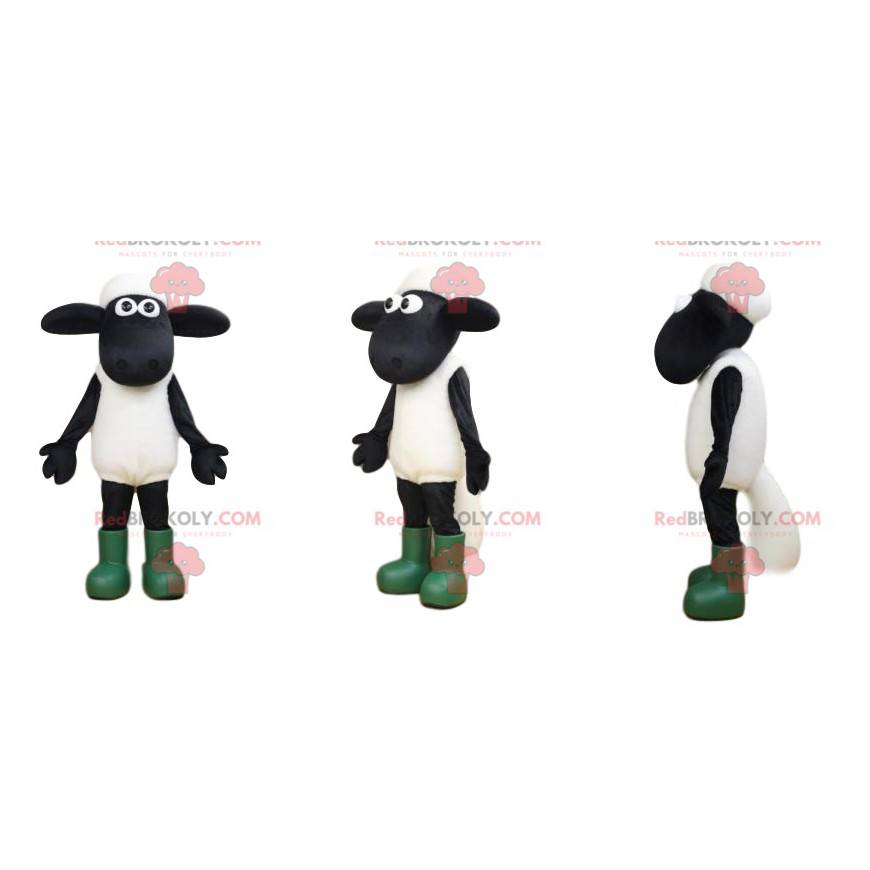 Mascota de oveja blanca y negra con grandes ojos y botas. - Mascota de oveja blanca y negra con grandes ojos y botas. -