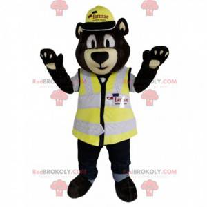 Mascote urso pardo com capacete e colete amarelo -