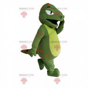 Mascotte dinosauro verde con punti arancioni e bordeaux -