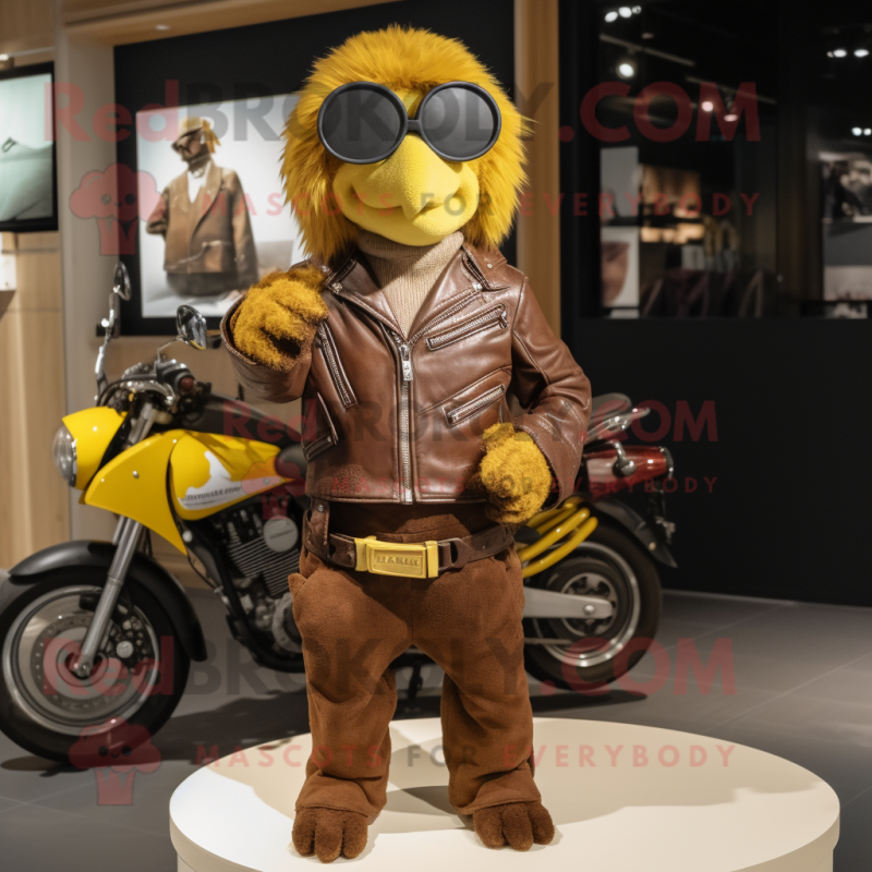 Brown Canary mascot costume character dressed with a Moto Jacket and Handbags