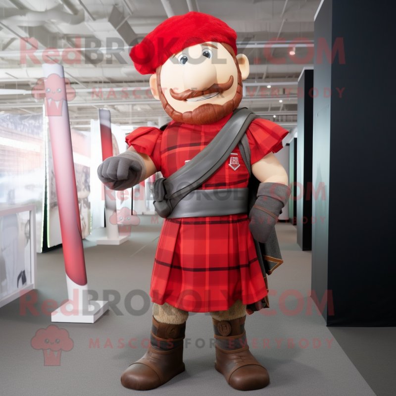 Red Roman Soldier mascot costume character dressed with a Flannel Shirt and Wraps