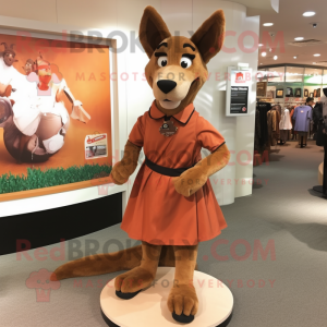 Brown Dingo mascot costume character dressed with a A-Line Dress and Shoe clips