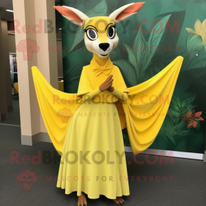 Lemon Yellow Gazelle mascot costume character dressed with a A-Line Skirt and Shawl pins