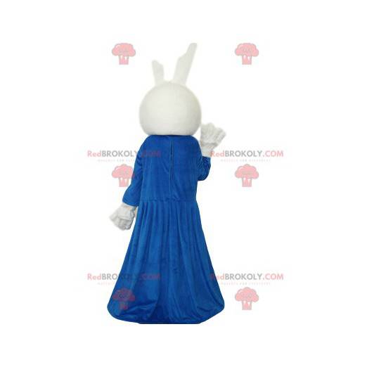 Biały królik maskotka z niebieską sukienką i czerwoną kokardką