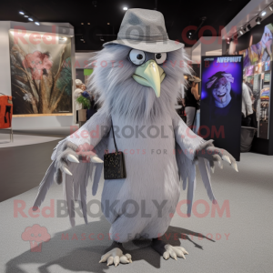 Silver Harpy mascot costume character dressed with a Coat and Hats
