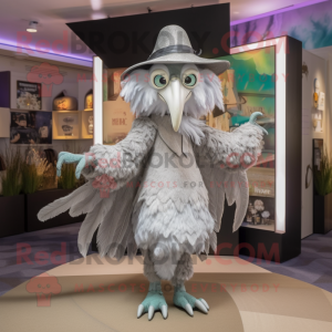 Silver Harpy mascot costume character dressed with a Coat and Hats