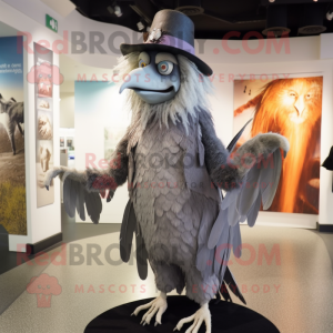 Silver Harpy mascot costume character dressed with a Coat and Hats