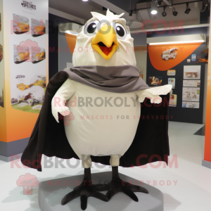 Cream Blackbird mascot costume character dressed with a Shorts and Scarf clips