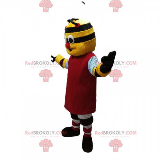 Mascota de personaje amarillo y negro con una camiseta roja -