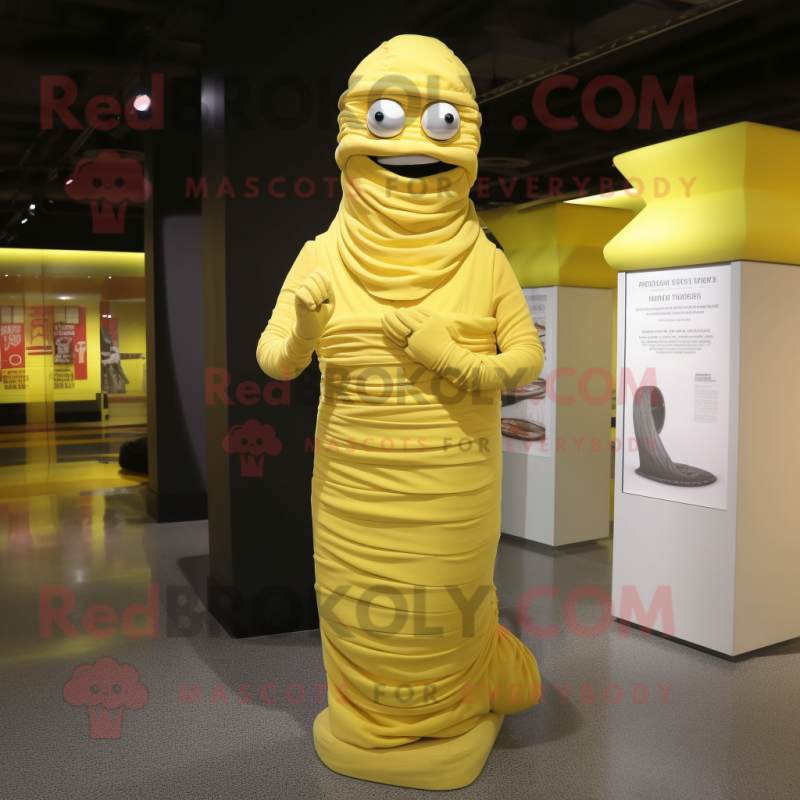 Lemon Yellow Mummy mascot costume character dressed with a Empire Waist Dress and Keychains