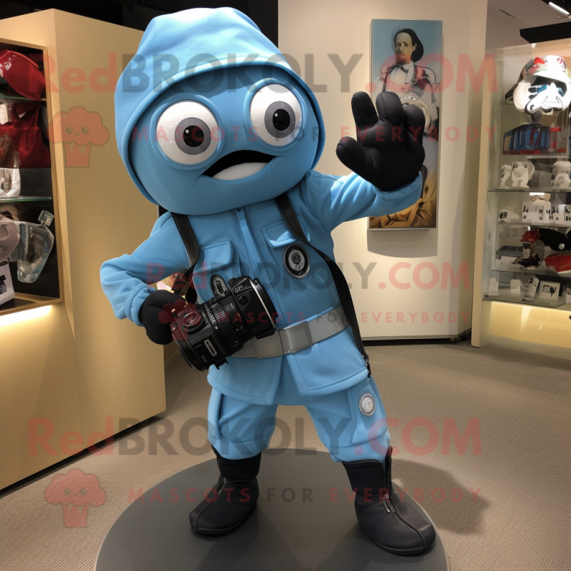 Sky Blue Camera mascot costume character dressed with a Moto Jacket and Shoe clips Sky Blue Camera mascot costume character dressed with a Moto Jacket and Shoe clips