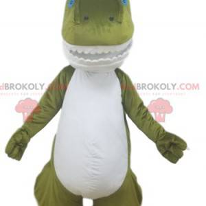 Groene en witte dinosaurusmascotte met mooie tanden -