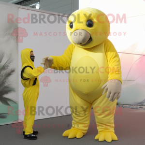 Lemon Yellow Glyptodon mascot costume character dressed with a Jumpsuit and Mittens