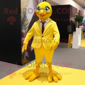 Yellow Quail mascot costume character dressed with a Blazer and Shoe laces