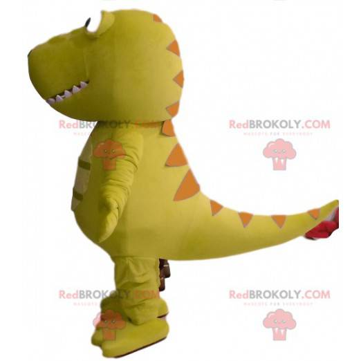 Groene dinosaurusmascotte met een grappig hoofd - Redbrokoly.com