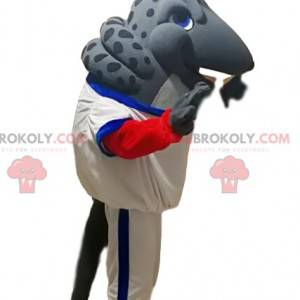 Mascotte de tatou gris avec une tenue de sport blanche -