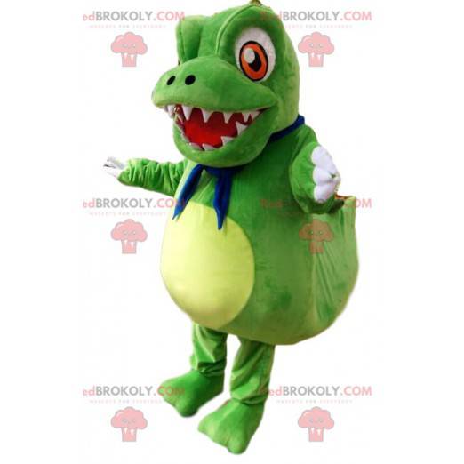 Mascote pequeno dinossauro verde com grandes olhos laranja -