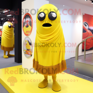 Yellow Cyclops mascot costume character dressed with a Cover-up and Scarves