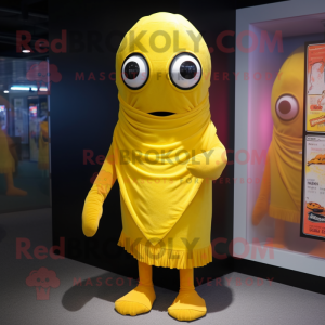 Yellow Cyclops mascot costume character dressed with a Cover-up and Scarves