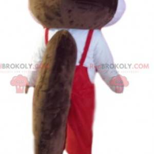 Mascotte d'écureuil marron et blanc avec une salopette rouge -