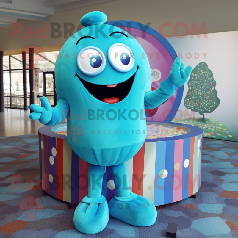Turquoise Candy Box mascot costume character dressed with a Cover-up and Rings Turquoise Candy Box mascot costume character dressed with a Cover-up and Rings