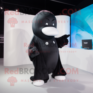 Black Beluga Whale mascot costume character dressed with a Cover-up and Coin purses